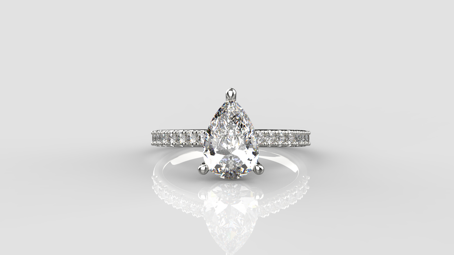 Pear Cut Moissanite Solitaire Ring with small Moissanites on the shank in 9ct White Gold